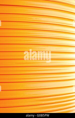 Background fiber optic cable on the cable drum Stock Photo