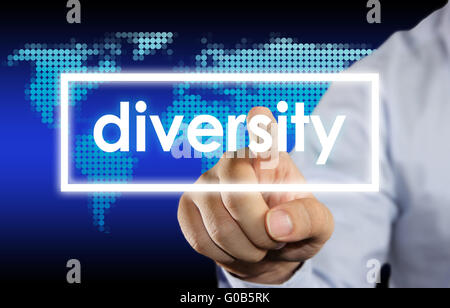 Businessman clicking Diversity word on virtual screen Stock Photo