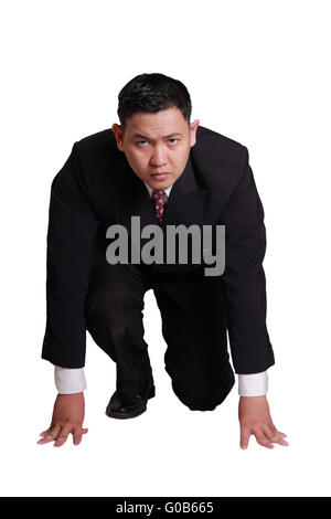 Business concept image of an Asian businessman in start position ready to run Stock Photo