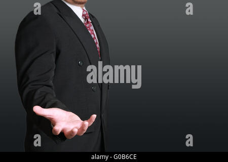 Business concept image of a businessman with open palm in position of holding something Stock Photo