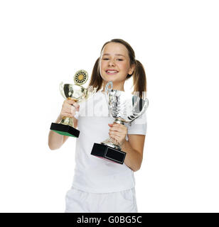 Proud young girl holding two trophies Stock Photo