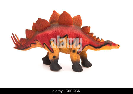 side view red stegosaurus toy on a white background Stock Photo