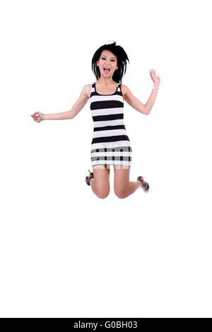 Oriental Woman Jumping in Black and White Dress Stock Photo