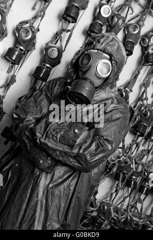 Photo of a man in WWII's clothes and gas mask Stock Photo