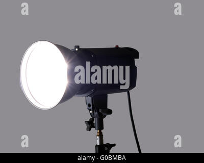 studio monolight stobe on lightstand firing gray background Stock Photo