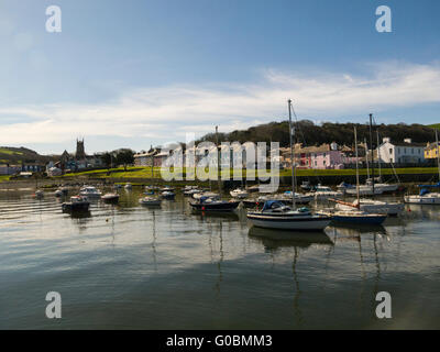 View across harbour to attractive quayside cottages Aberaeron Ceredigion Mid Wales a popular Welsh seaside resort on lovely April day weather Stock Photo