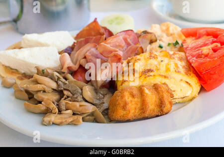 Breakfast : scrambled eggs, ham , mushrooms and ve Stock Photo