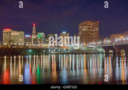 downtown Hartford Connecticut at dusk from across the Connecticut River. Stock Photo