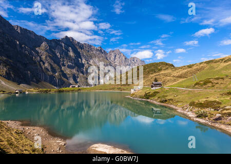 Panorama view of Truebsee (lake) on a sunny summer day with Braustock in background and beautiful reflection in water, canton of Stock Photo