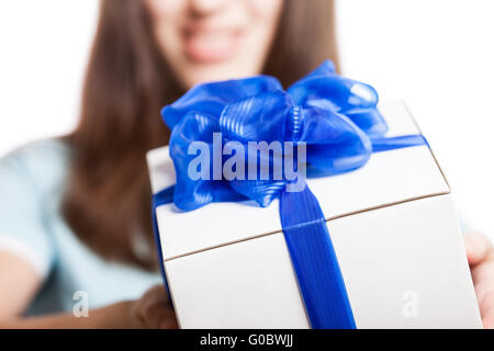 Smiling woman hand holding gift or present box Stock Photo