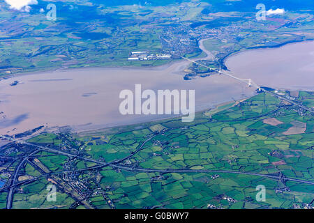 Aerial view River Severn Estuary with old Severn road bridges, between England and Wales and patchwork of agricultural fields Stock Photo