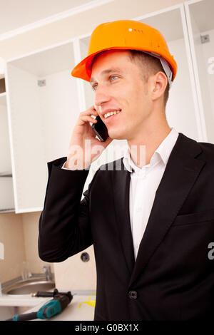 engineer talking on the phone in the interior Stock Photo