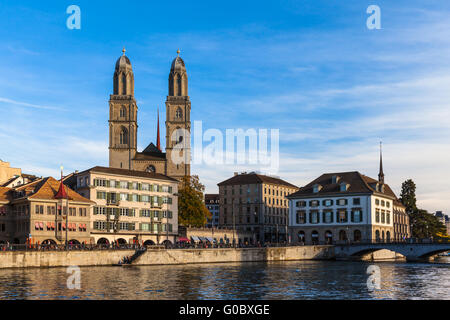 Beautiful view of Zurich old town with Grossmunster Church and Limmat river at dusk, Zurich, Switzerland. Stock Photo