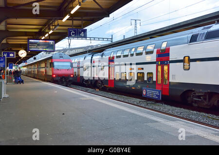 Geneva train station with both local train and double decker train Stock Photo