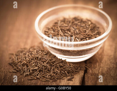 Caraway seeds in a glass bowl Stock Photo