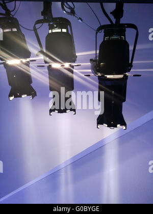 multiple spotlights on a theatre stage lighting rig Stock Photo