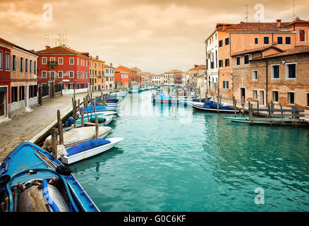 Narrow canal among old colorful houses on island of Murano Stock Photo