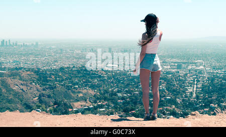 Young women posing in front of L.A. skyline Stock Photo