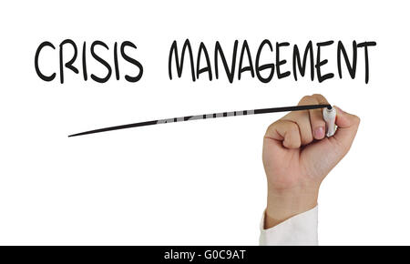 Business concept image of a hand holding marker and write Crisis Management isolated on white Stock Photo