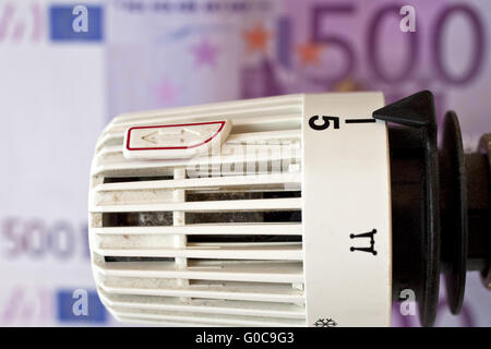 heating thermostat and Euro bills, heating coasts Stock Photo