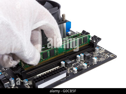 Installing memory module in DIMM slot on modern PC Stock Photo