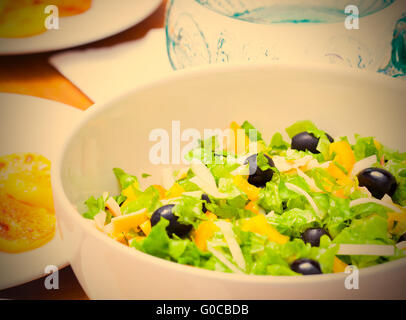 Assorted salad of green leaf lettuce with squid an Stock Photo