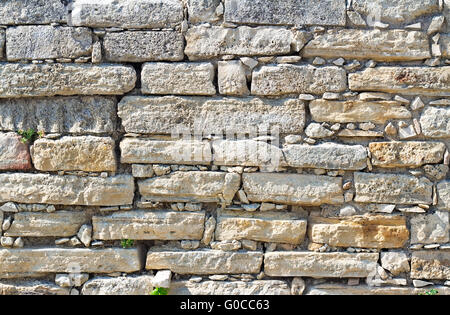 Fragment of an ancient wall from stones. (Backgrou Stock Photo