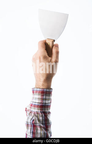 Male bricklayer's hand holding a plaster spatula on white background Stock Photo