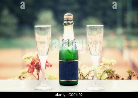detail on a bottle of champagne with free space for inscription and two glasses Stock Photo