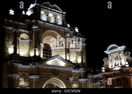 The illuminated facade of San Pedro Apostol Church in Antigua a city in the central highlands of Guatemala famous for its well-preserved Spanish Baroque-influenced architecture and a UNESCO World Heritage Site. Stock Photo