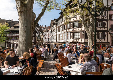 street cafe on Place Benjamin Zix timber framed Maison des Tanneurs, La Petite France, Strasbourg,  Alsace, France Stock Photo