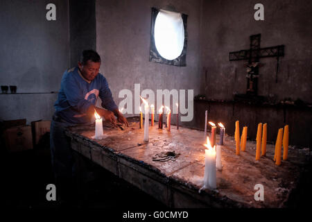 Local man at the cemetery in Chichicastenango also known as Santo Tomas Chichicastenango a town in the El Quiche department of Guatemala, known for its traditional Kiche Maya culture. Stock Photo