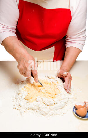 Cooking ukrainian varenyky with cherries. Serie. Stock Photo