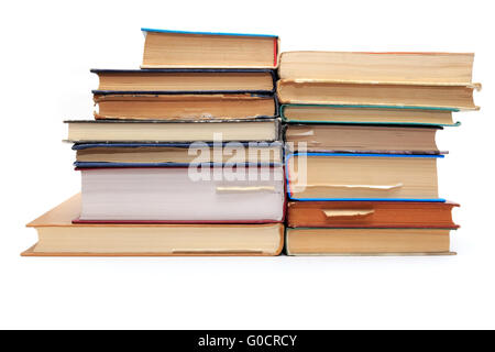 A stack of old books with bookmarks in different directions on different pages. Stock Photo