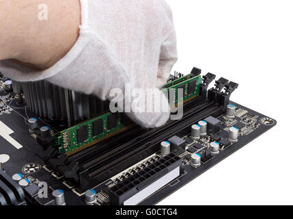 Installing memory module in DIMM slot on modern PC Stock Photo