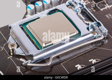 CPU socket on motherboard with installed a process Stock Photo