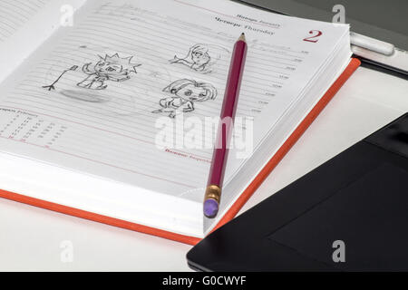 Laptop, daily log and pen Stock Photo