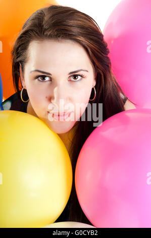Beautiful female with multicolored air balloons Stock Photo