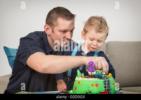 Little boy celebrating his father's second birthday Stock Photo