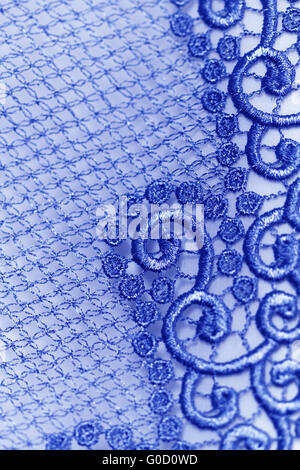 Decorative blue lace on insolated blue background Stock Photo