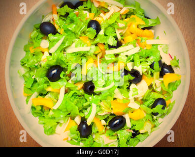 Assorted salad of green leaf lettuce with squid an Stock Photo