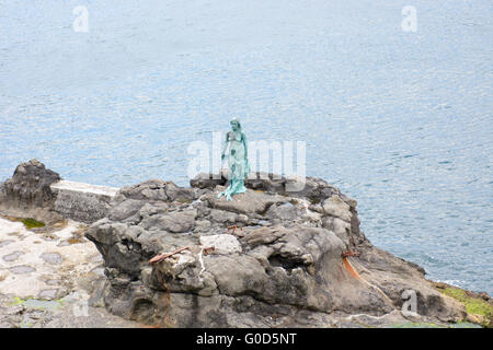 Statue of Selkie or Seal Wife in the village of Mikladalur on Kalsoy Stock Photo
