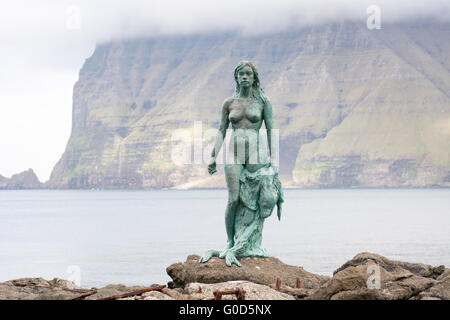 Statue of Selkie or Seal Wife in the village of Mikladalur on Kalsoy Stock Photo