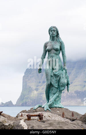 Statue of Selkie or Seal Wife in the village of Mikladalur on Kalsoy Stock Photo