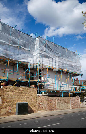 Scaffolding on a renovated house in London Stock Photo