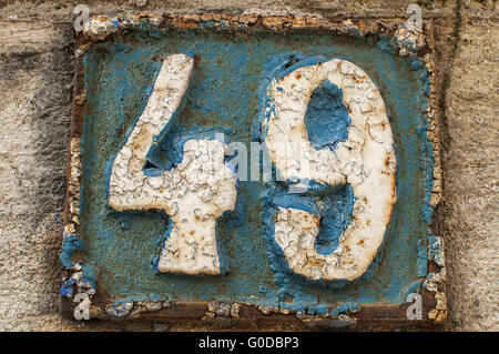 Old retro weathered painted cast iron plate 49 Stock Photo