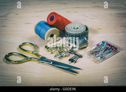 scissors, thread, pins. Photo in old image style Stock Photo