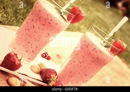2 glasses with a berry milkshake and decoration on Stock Photo