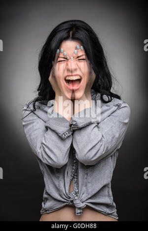 Multi exposure portrait of emotional brunette. Stock Photo