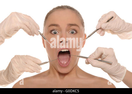 frightened woman on reception at the dentist's Stock Photo